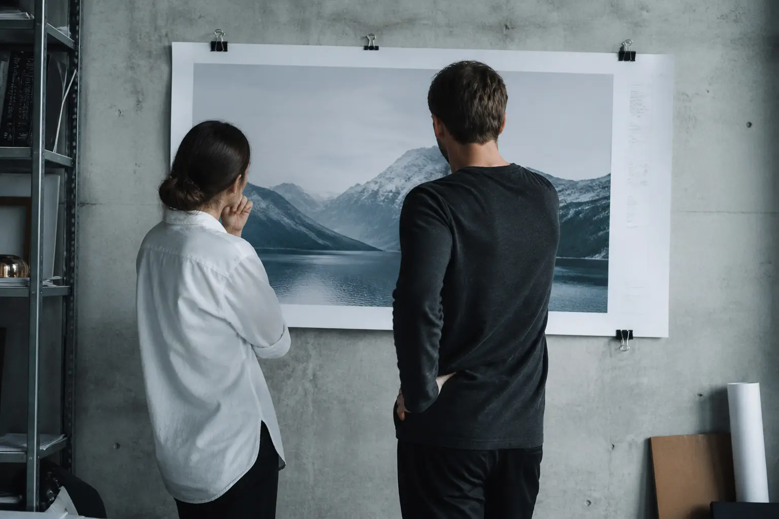 Designers reviewing a large print